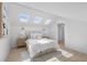 Bright bedroom featuring a skylight and a luxuriously decorated bed at 5286 Waterview Dr, North Charleston, SC 29418
