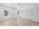 Bright bedroom featuring a ceiling fan, neutral walls, and two windows providing ample natural light at 5286 Waterview Dr, North Charleston, SC 29418