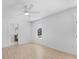 Bright bedroom with a ceiling fan, light wood floors, and a connecting bathroom at 5286 Waterview Dr, North Charleston, SC 29418