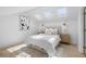 Bright bedroom featuring three skylights, a comfortable bed, and stylish decor at 5286 Waterview Dr, North Charleston, SC 29418