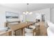 Dining room featuring modern chandelier, wood floors, and seating for six at 5286 Waterview Dr, North Charleston, SC 29418