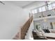 Inviting entryway with wood stairs, black metal railings, and view of living room at 5286 Waterview Dr, North Charleston, SC 29418