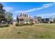 Well-maintained home showcasing a combination of brick and siding exterior with mature trees at 5286 Waterview Dr, North Charleston, SC 29418