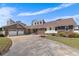 Beautiful home with brick and siding, boasting a large driveway and mature landscaping at 5286 Waterview Dr, North Charleston, SC 29418
