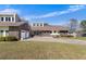 Spacious home with an attached two-car garage, and a circular driveway, surrounded by a lush lawn at 5286 Waterview Dr, North Charleston, SC 29418