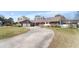 Charming brick home features an expansive driveway and a well-manicured lawn at 5286 Waterview Dr, North Charleston, SC 29418