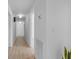 Bright hallway with white walls, wood floors, and minimal decor at 5286 Waterview Dr, North Charleston, SC 29418