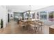 Open-concept kitchen and dining area featuring an island, modern lighting, and a neutral color palette at 5286 Waterview Dr, North Charleston, SC 29418