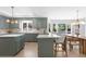 Open-concept kitchen and dining area featuring an island with seating and modern lighting at 5286 Waterview Dr, North Charleston, SC 29418