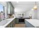 Modern kitchen with a view through to the dining area featuring white countertops and stainless steel appliances at 5286 Waterview Dr, North Charleston, SC 29418