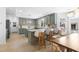 Open-concept kitchen and dining area featuring an island with seating and modern lighting at 5286 Waterview Dr, North Charleston, SC 29418