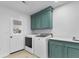 The laundry room features green cabinets, countertop space and exterior access at 5286 Waterview Dr, North Charleston, SC 29418