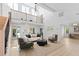 Bright open-concept living room with tall windows and modern decor at 5286 Waterview Dr, North Charleston, SC 29418