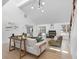 Bright living room with vaulted ceilings, light wood floors, and a black fireplace at 5286 Waterview Dr, North Charleston, SC 29418