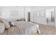 Bright bedroom boasts wood floors, modern decor, and access to the ensuite bath at 5286 Waterview Dr, North Charleston, SC 29418