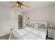 Inviting bedroom featuring soft lighting, neutral decor, and a plush bed with decorative pillows at 5556 Indigo Fields Blvd, North Charleston, SC 29418