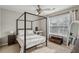 A serene bedroom filled with natural light and a four poster bed at 5556 Indigo Fields Blvd, North Charleston, SC 29418