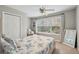 Bright bedroom with a large window and neutral decor at 5556 Indigo Fields Blvd, North Charleston, SC 29418