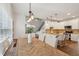 Open-concept dining area showcasing a wooden table set, cozy seating, and plenty of natural light at 5556 Indigo Fields Blvd, North Charleston, SC 29418