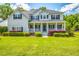 Charming two-story home with manicured lawn and inviting front porch at 5556 Indigo Fields Blvd, North Charleston, SC 29418