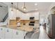 Open kitchen design showcasing a large island, granite countertops, and a cozy seating area at 5556 Indigo Fields Blvd, North Charleston, SC 29418