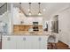 Bright kitchen featuring a granite-topped island, stainless steel appliances, and ample cabinet space at 5556 Indigo Fields Blvd, North Charleston, SC 29418