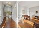 Bright living room featuring hardwood floors, and sliding doors leading to an outdoor balcony at 5556 Indigo Fields Blvd, North Charleston, SC 29418