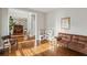 Cozy living room area featuring a vintage couch and a doorway that leads to dining area at 5556 Indigo Fields Blvd, North Charleston, SC 29418