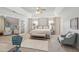 A spacious main bedroom featuring tray ceilings and a cozy sitting area at 5556 Indigo Fields Blvd, North Charleston, SC 29418