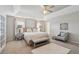 Relaxing main bedroom filled with natural light, a seating area, and neutral decor at 5556 Indigo Fields Blvd, North Charleston, SC 29418