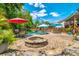Backyard with inground pool, fire pit, and outdoor seating at 5556 Indigo Fields Blvd, North Charleston, SC 29418