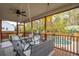 Screened-in porch with seating area overlooking pool and yard at 5556 Indigo Fields Blvd, North Charleston, SC 29418