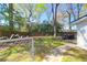 Spacious backyard with mature trees and a fenced perimeter perfect for outdoor activities at 5801 Chaucer Dr, Hanahan, SC 29410