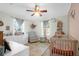 Bright Bedroom with a crib, rocking chair, and charming decor creating a warm and inviting space at 5801 Chaucer Dr, Hanahan, SC 29410