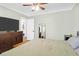 Well-lit bedroom with hardwood floors, a ceiling fan, and an ample dresser creates a relaxing atmosphere at 5801 Chaucer Dr, Hanahan, SC 29410