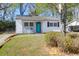 Charming single-story home featuring a bright blue front door and freshly painted white siding at 5801 Chaucer Dr, Hanahan, SC 29410