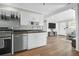 Bright kitchen with white cabinets, stainless steel appliances, and a seamless connection to living area at 5801 Chaucer Dr, Hanahan, SC 29410