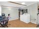 Functional laundry room with exposed beam ceiling, washer, dryer, and gaming chair offering practicality and style at 5801 Chaucer Dr, Hanahan, SC 29410