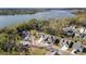 Aerial view of a neighborhood with waterfront homes, showcasing the community's proximity to the lake at 6005 Coral Berry Rd, Hanahan, SC 29410