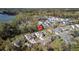 Aerial view of a home in a residential area marked with a red pin, surrounded by trees and houses at 6005 Coral Berry Rd, Hanahan, SC 29410