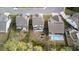 Aerial view of the home featuring a backyard firepit, patio, swimming pool, and landscaped surroundings at 6005 Coral Berry Rd, Hanahan, SC 29410