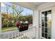 Charming balcony featuring a planter box with colorful flowers and views of the surrounding trees at 6005 Coral Berry Rd, Hanahan, SC 29410