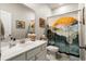 Bathroom with white cabinets, sink, toilet, tub, and colorful shower curtain at 6005 Coral Berry Rd, Hanahan, SC 29410
