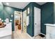 Bathroom featuring dual sinks, a toilet, and tiled floors and walls at 6005 Coral Berry Rd, Hanahan, SC 29410