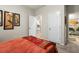 Bedroom with an orange quilt bed and ensuite bathroom at 6005 Coral Berry Rd, Hanahan, SC 29410