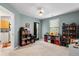 Spacious room with neutral walls, carpet flooring, and an open door to the laundry room at 6005 Coral Berry Rd, Hanahan, SC 29410