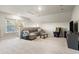 Bright bonus room with plush carpeting, modern furniture, and plenty of natural light at 6005 Coral Berry Rd, Hanahan, SC 29410