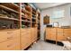 Walk-in closet with custom wood shelving and drawers at 6005 Coral Berry Rd, Hanahan, SC 29410