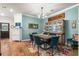 Stylish dining room with modern chandelier, seating for six, and colorful rug at 6005 Coral Berry Rd, Hanahan, SC 29410