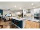 Modern kitchen with a large center island, stainless steel appliances, and open floor plan at 6005 Coral Berry Rd, Hanahan, SC 29410
